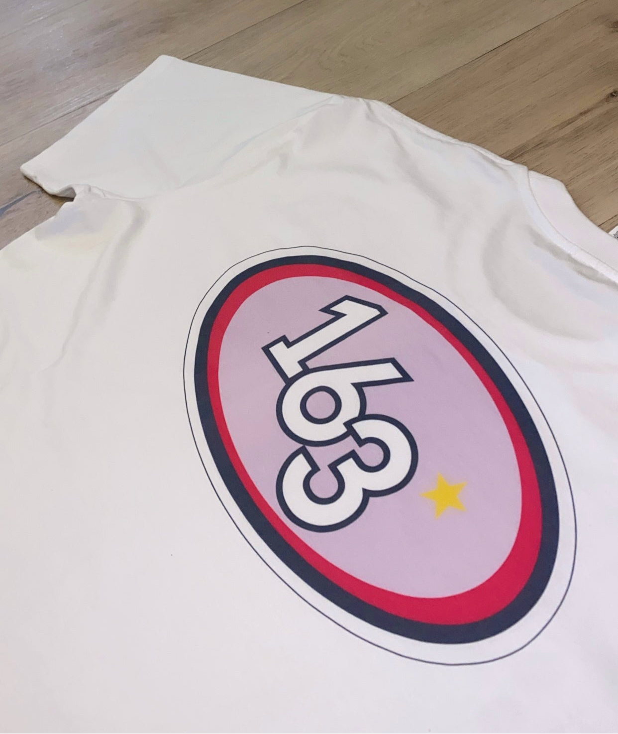 “THE WHITE TEE”.